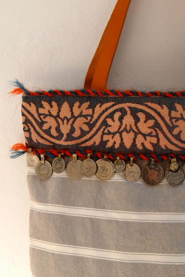 Close up photo, Mina's handmade ethnic bag with coins