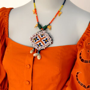 Mina's handmade kuchi metallion necklace