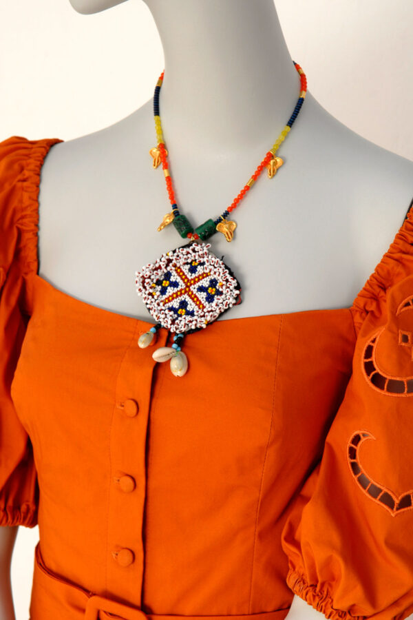 Mina's handmade kuchi metallion necklace
