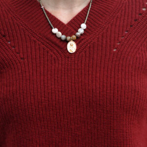 Wearing Mina's handmade pendant with semiprecious beads