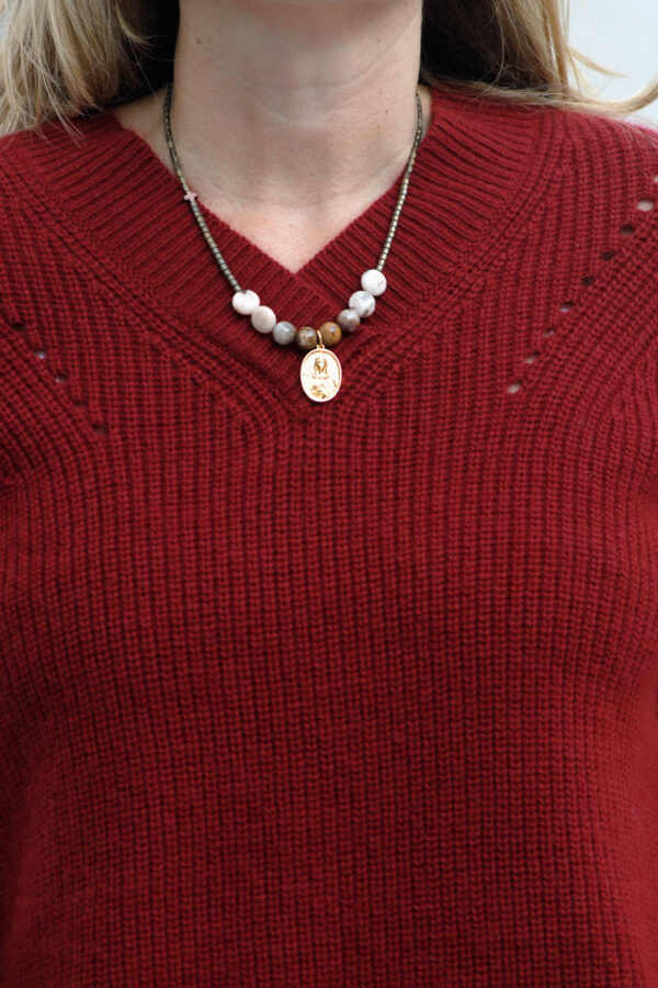Wearing Mina's handmade pendant with semiprecious beads
