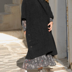 Wearing black sleeveless knit coat and grey long dress