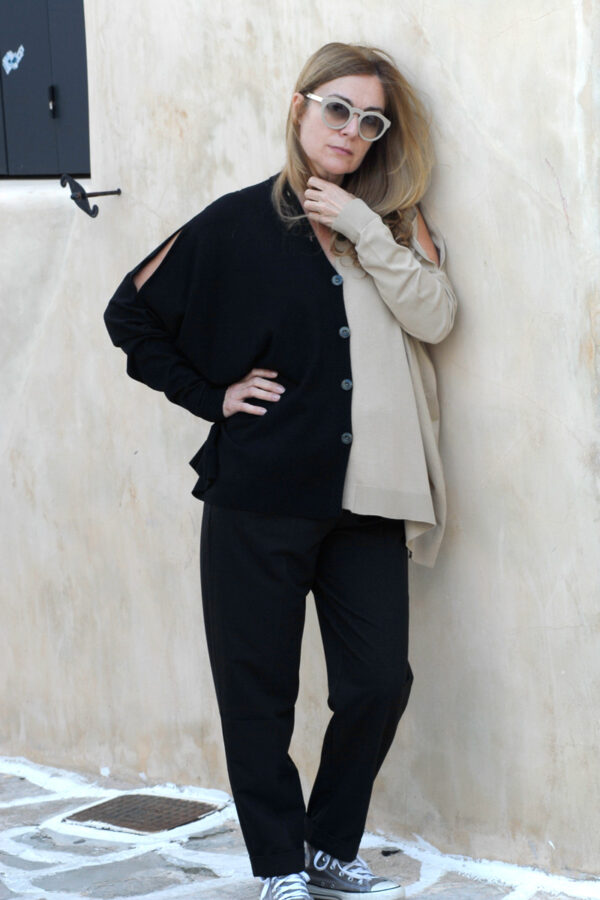 Wearing beige black blouse and black pants