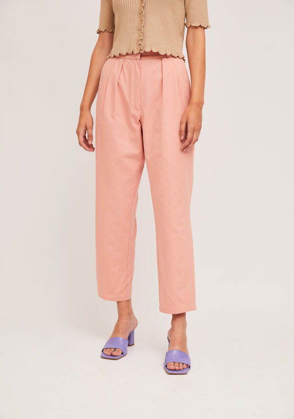 Model wearing pink cotton pants