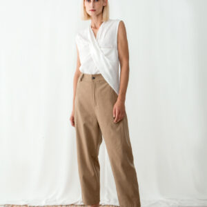 Model wearing high waisted sand pants