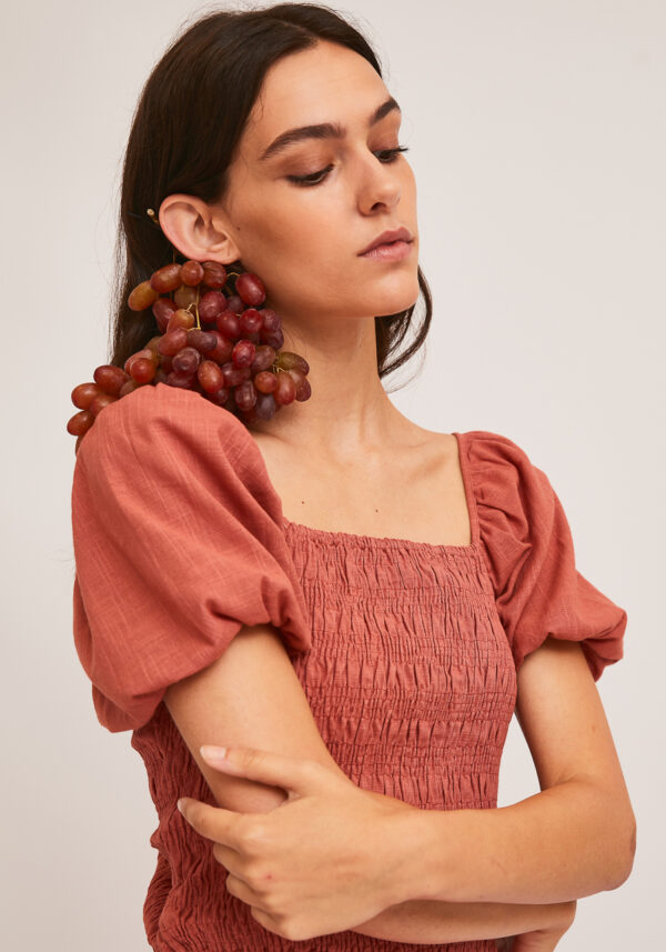 Model wearing pink short sleeves top