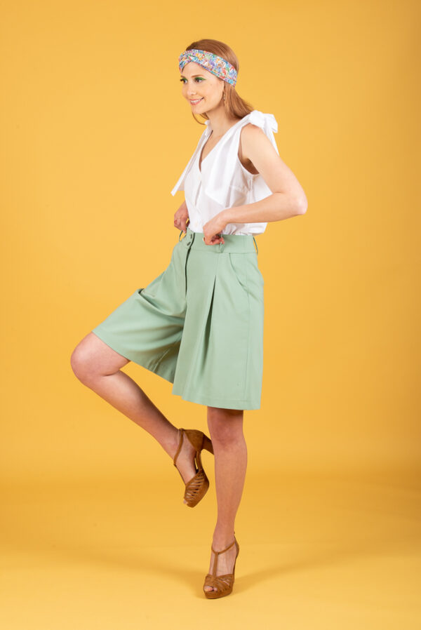 Model wearing green tea shorts