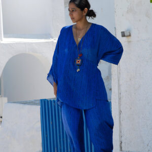 Model wearing electric blue silk blouse