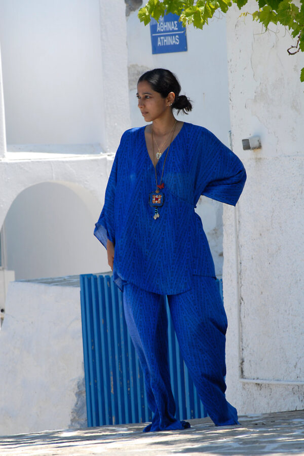 Model wearing electric blue silk blouse