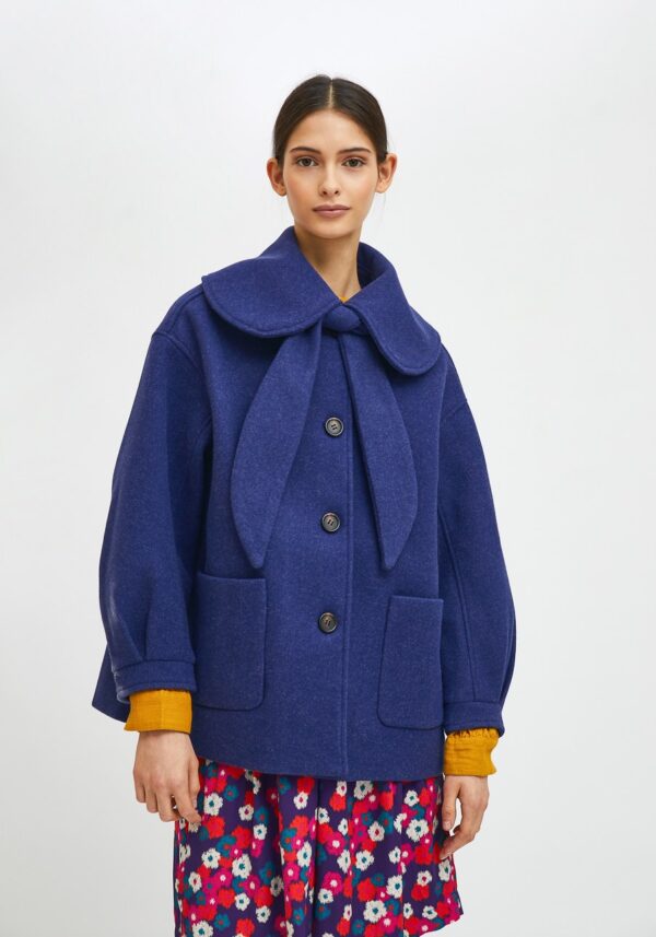 Model wearing blue cropped coat