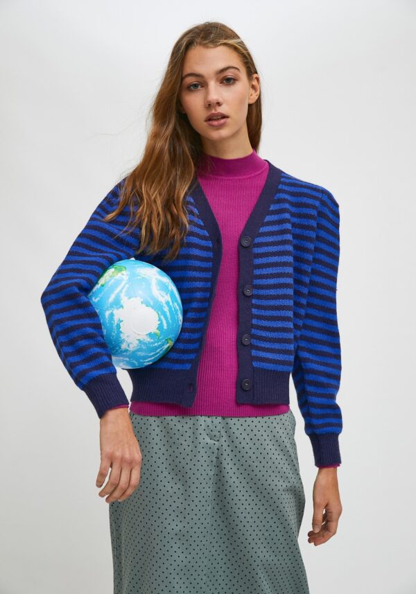 Model wearing striped knit cardigan