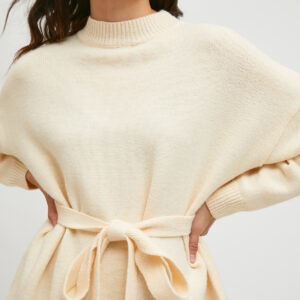 Model wearing white knit jumper