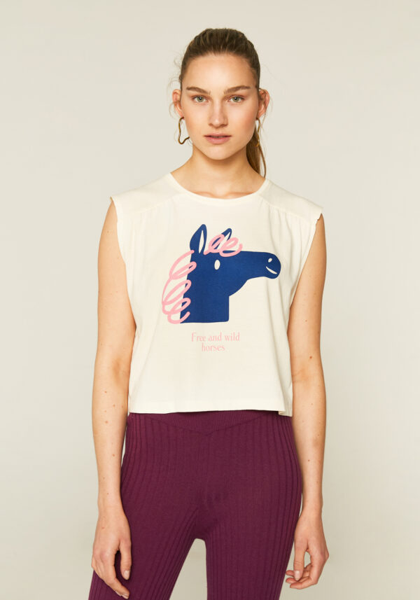 Model wears sleeveless horse print t-shirt