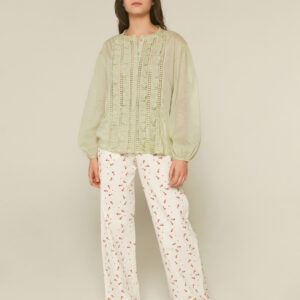 Model wears, light green cotton embroidered blouse