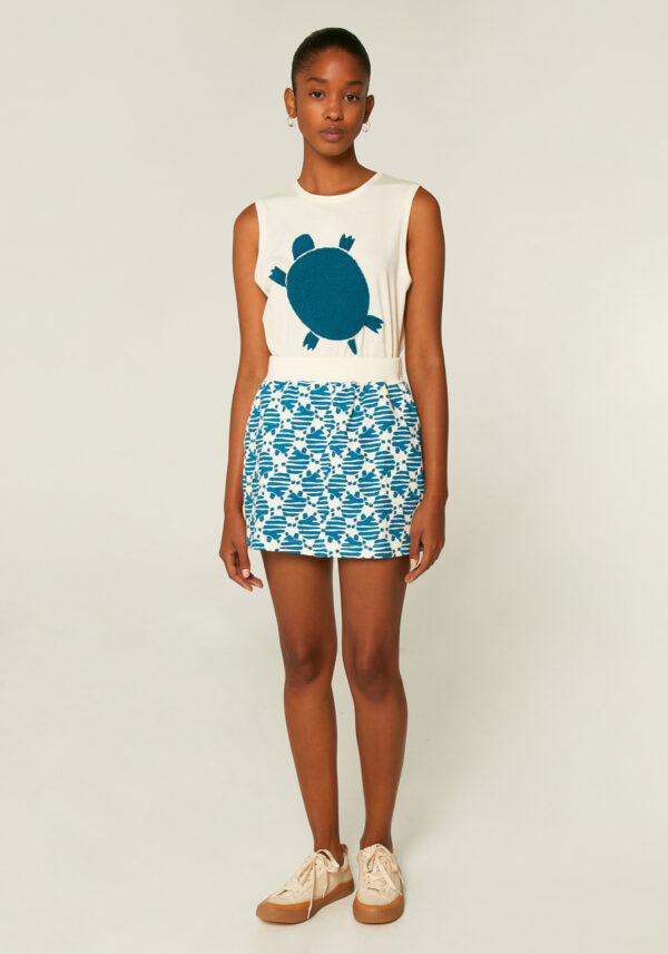 Model is wearing cotton turtle print skirt