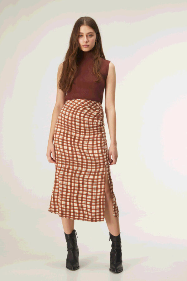 Model wears brown print midi skirt