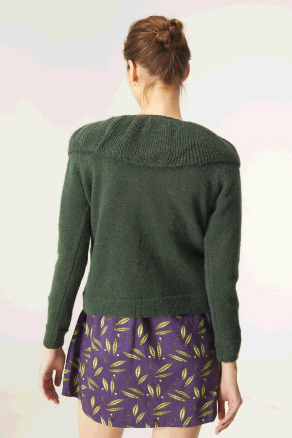 Back photo, model wears green long sleeve jumper