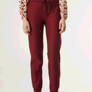 Close up photo, model wears burgundy quilted pants