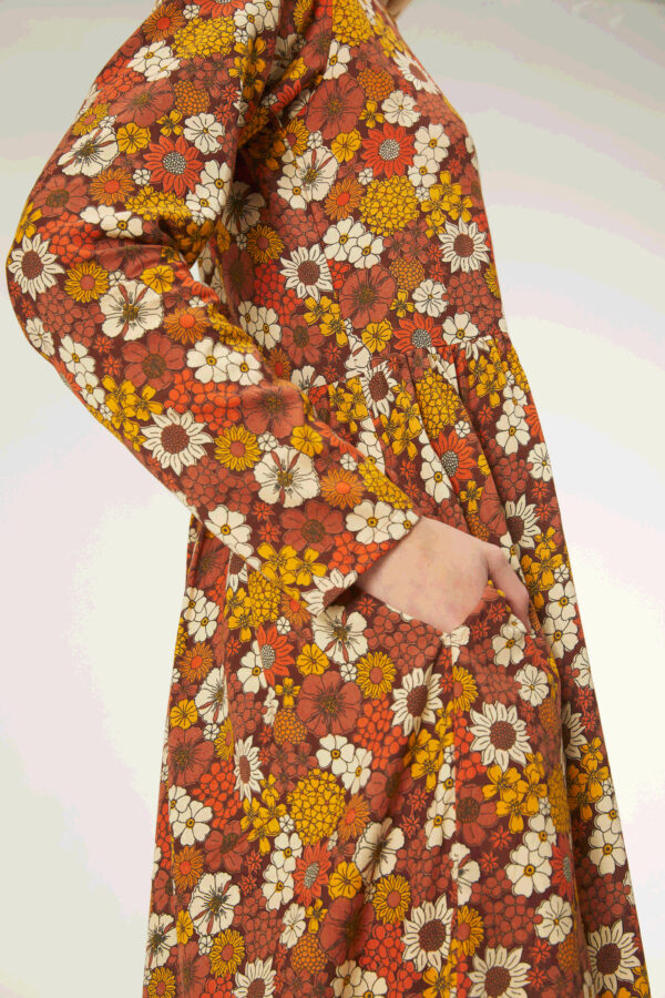 Close up photo, model wears floral print midi dress