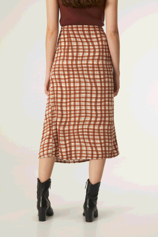 Back photo model wears brown gingham print midi skirt