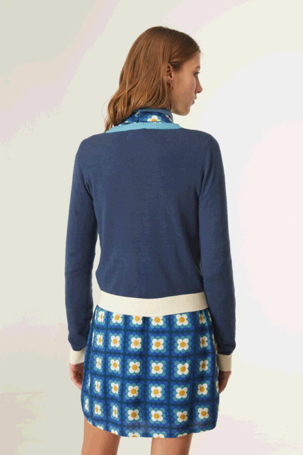 Back photo, model wears viscose knitted blouse