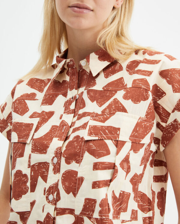Model wears poplin print shirt