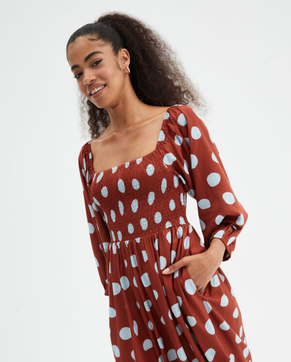 Model wears polka dot dress