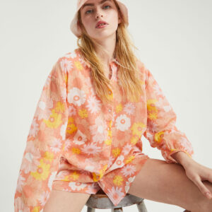 Model wears floral print cotton shirt