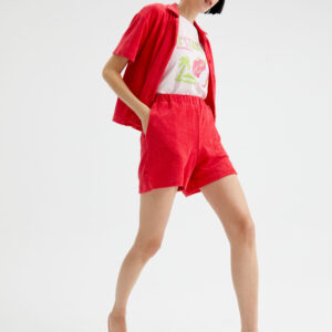 Model wears fucsia towelling shorts