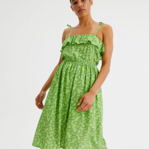 Model wears lime viscose dress