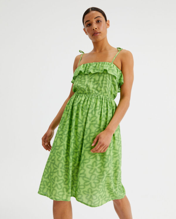 Model wears lime viscose dress