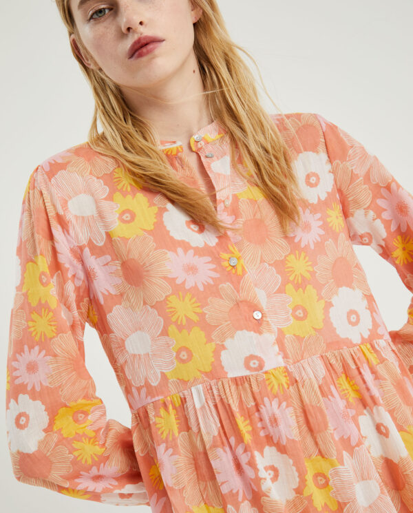 Close up photo model wears pink flower print midi tunic