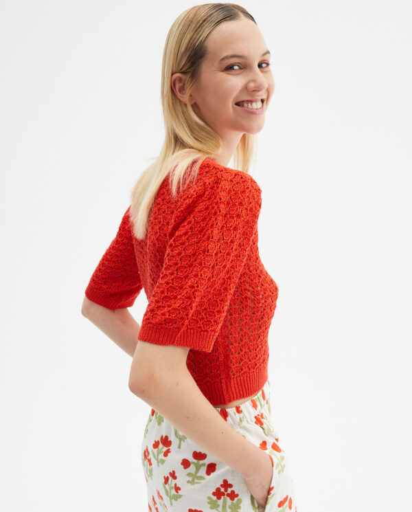 Profile photo model wears red croshet jumper