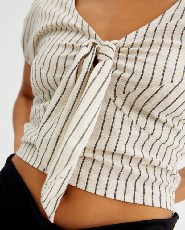 Close up photo model wears striped cotton short top