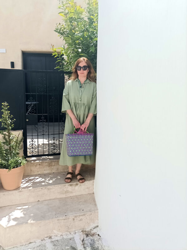 Model wears light green dress