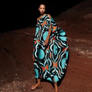 Model wears asymetrical printed dress